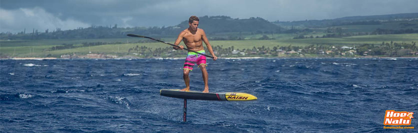 Kai Lenny with SUP foil flying over the ocean